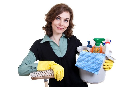 A local cleaner maintaining a small office kitchen and washroom in Earlscourt