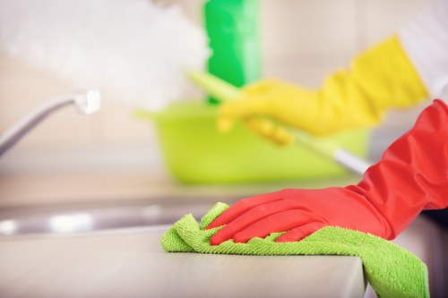 Cleaner managing hygiene and waste safely in a clean environment